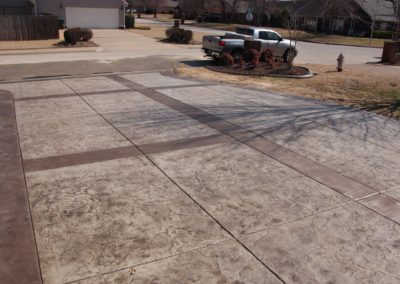 A truck parked in the driveway of a house.