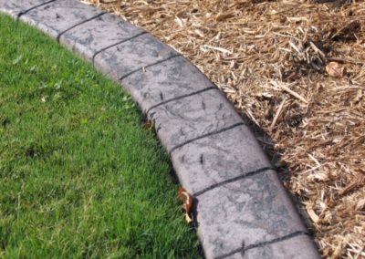 A close up of the edge of a garden bed