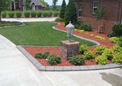 A fire hydrant in the middle of a driveway.