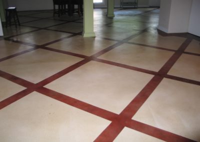 A floor with red and white lines on it