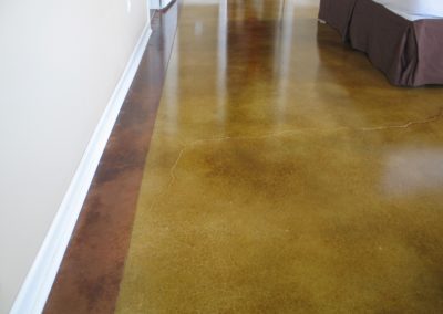 A brown floor with a white line on the bottom