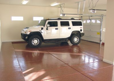 A white hummer parked in the garage