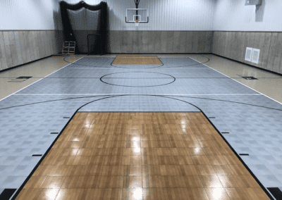 An indoor basketball court with hardwood floors.