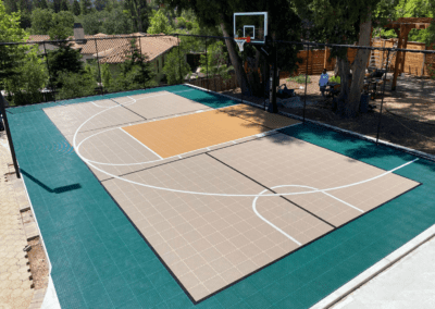 A basketball court in a backyard.